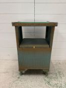 A green painted glass topped Lloyd Loom bedside table (H64cm W40cm D30cm)