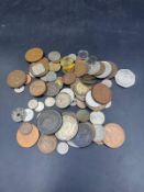 A selection of coins, various denominations, countries and conditions.