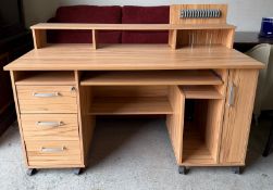 A computer desk with retractable keyboard surface flanked by three drawers and storage (H110cm