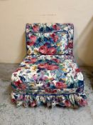 A florally upholstered lounge chair