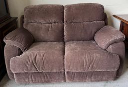 A fawn coloured two seater sofa