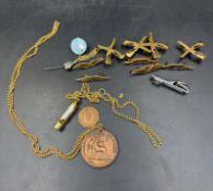 A selection of pin badges and a Berkshire education Good Attendance medal