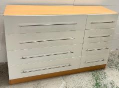 A chest of drawers with white gloss front (H134cm W87cm D40cm)