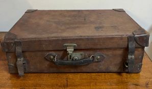 A leather suitcase opening to straps (H20cm W72cm D44cm)