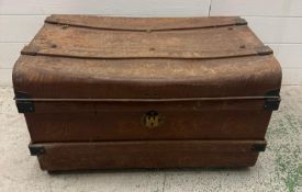 A vintage metal trunk with handles to sides