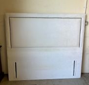 A contemporary upholstered headboard with stud detail (H138cm W153cm)