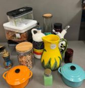 A selection of kitchen items to include storage jars and olive oil jugs