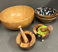 A selection of wooden bowls to include pestle and mortars
