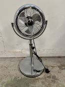 Two pedestal fans with adjustable heights
