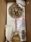 A gold starburst table lamp