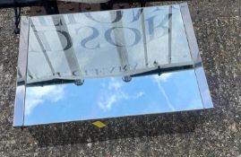 A mirrored medicine or bathroom cabinet