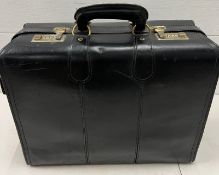 A black leather brief case bag