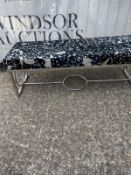 A bench seat on chrome legs