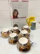 A selection of cups and mugs, some boxed