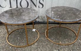 A pair of faux marble top side tables