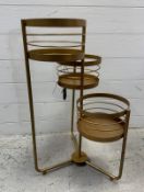 A contemporary gold painted three tier foldable plant stand (H66cm)