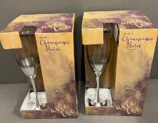 Two boxes of champagne flutes
