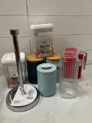 A selection of kitchen storage jars and Umbra paper towel holder