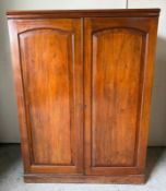 A camphor wood specimen cabinet by J.J. Hill & Son of Willesden, London, the twin panelled doors