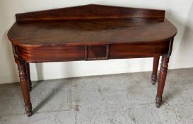 A mahogany side table on turned legs (H82cm W126cm D42cm)