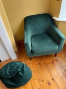 A contemporary green armchair along with foot cushion