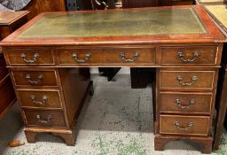 A pedestal desk with green leather top AF