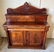 A Victorian Chiffonier with panelled doors opening to shelves, scrolling carved gallery back. (140cm