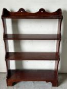 A mahogany waterfall bookcase (H98cm W67cm D23cm)