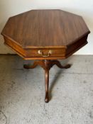 An octagonal side table with a hinged top opening to storage (H70cm Dia71cm)