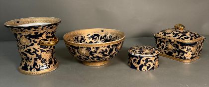 A selection of blue grounds and scrolling gilt ceramics to include lidded pots, vase and a bowl