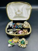 A selection of quality costume jewellery, mainly brooches of various designs and finishes.