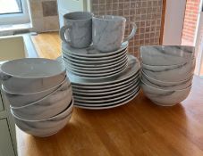 A marble style dinner service to include eight bowls, dinner plates and side plates