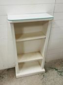 A white wooden, painted, shelving unit with three shelves and glass top (61cm x 30cm x 111cm)