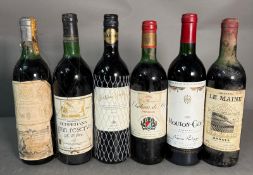 Six bottles of red wine. A Marques de Rascal 1971, a Rioja Gran Reserva 1966, a Hard Shiraz, a