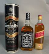 A bottle of Glenfiddich Single Malt Scotch Whisky, together with a bottle of Jack Daniel’s Tennessee