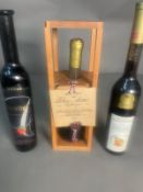 A bottle of Tokaji 1964, a Vin De Fraise and an Austria Liquor