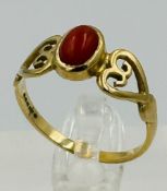 A 9ct gold ring with central coral ring approximate weight 1.9g and size P