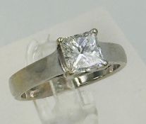 A diamond set single stone ring, on a four claw set princes cut diamond, hallmarked 950 for