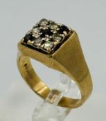 A 9ct gold signet ring with white and red stones, approximate weight 6.2g and size U
