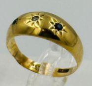 An 18ct gold ring with an approximate weight of 2.2g and size M.5