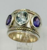 A silver amethyst and aquamarine fashion ring approximate size N