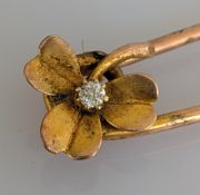 A diamond-set yellow gold pin brooch, unmarked, tests for 9ct, 5.25g