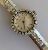 A vintage ladies Marvin cocktail watch with diamond bezel on a white gold case and integrated textur