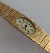 A vintage ladies Imado manual wristwatch with integrated bark-effect yellow gold bracelet strap 