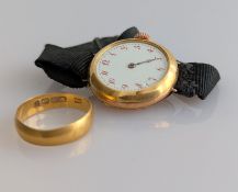 A 22ct yellow gold wedding band, hallmarked, 2.7g and a 1920s gold cased ladies manual wristwatch