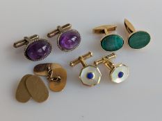 A plain oval set of yellow gold cufflinks, another pair decorated with malachite and two other