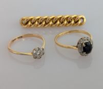 An Art Deco diamond flower ring on a yellow gold setting; a sapphire and diamond cluster ring