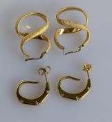 A pair of textured yellow gold earrings and another pair with diamond decoration, both hallmarked 