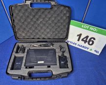 A QTX VHF Microphone System with One Wireless Lapel Microphone and Spare Receiver