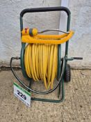 A Hose Reel Trolley Hose and A HOZELOCK Sprinkler
